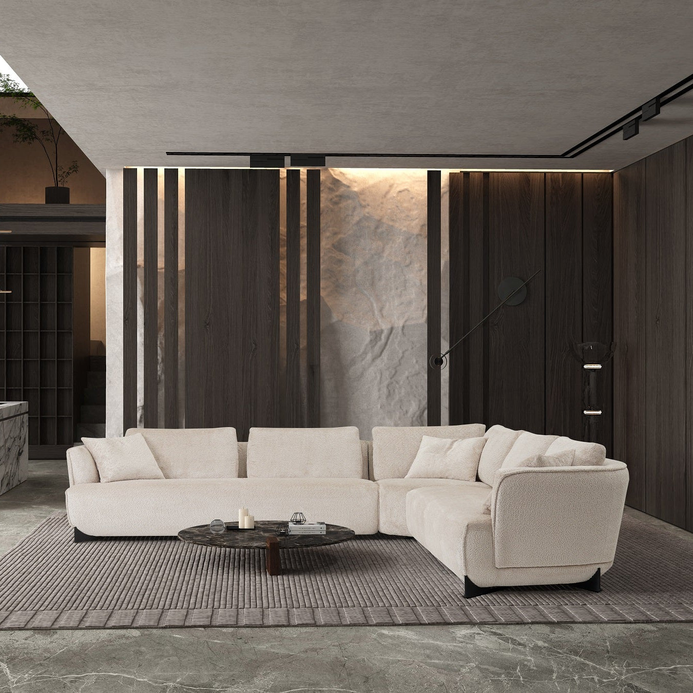 Modern living room with a beige sectional sofa, coffee table, and decorative elements.