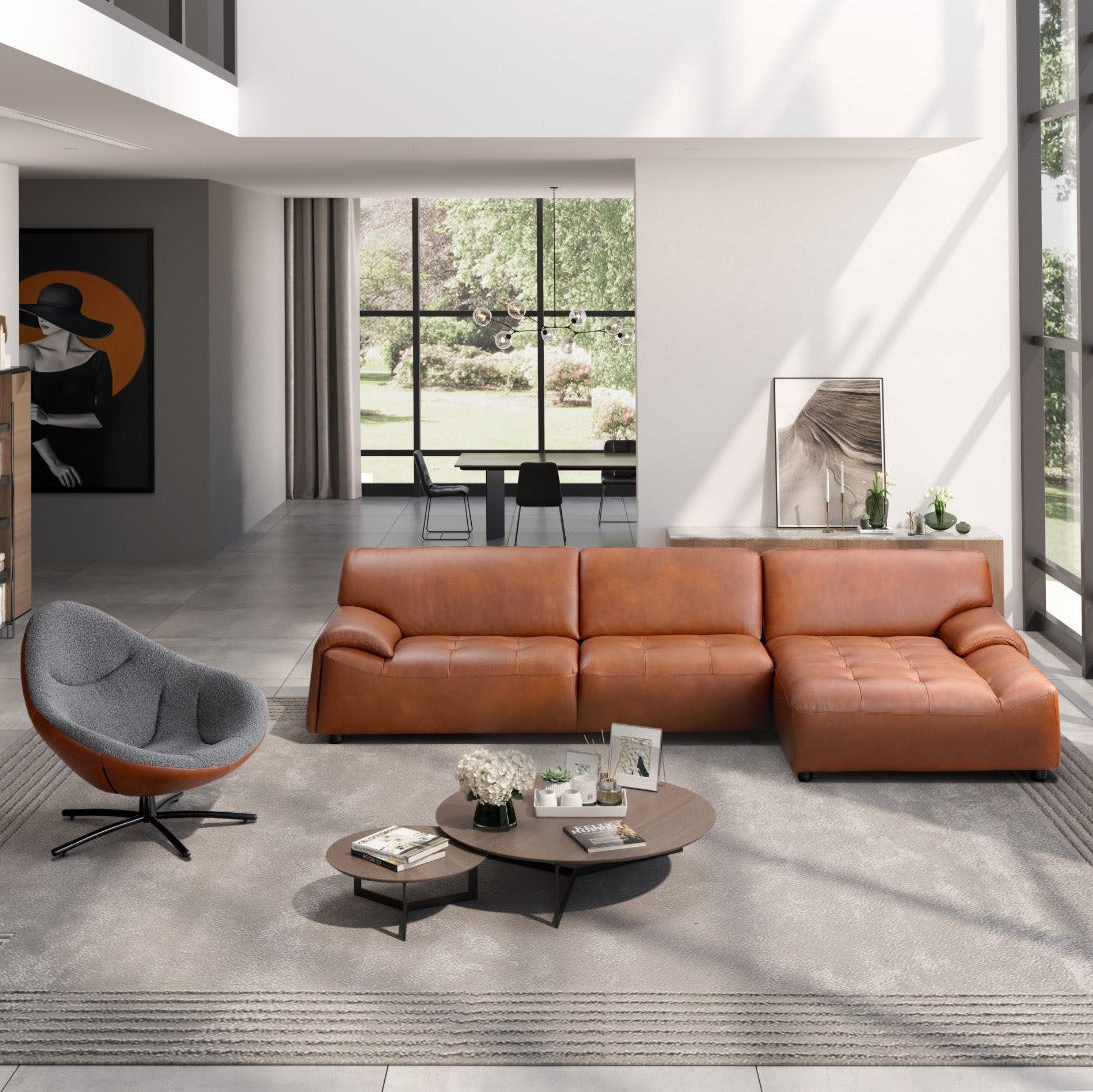 Modern living room with a brown leather sofa and a round coffee table.